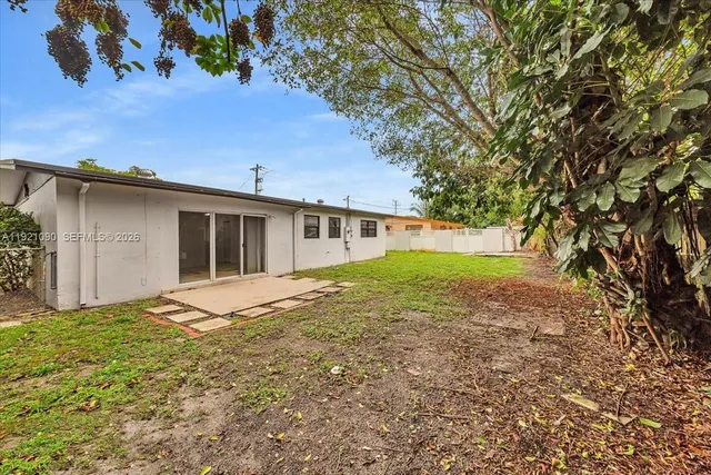 a house view with a garden space