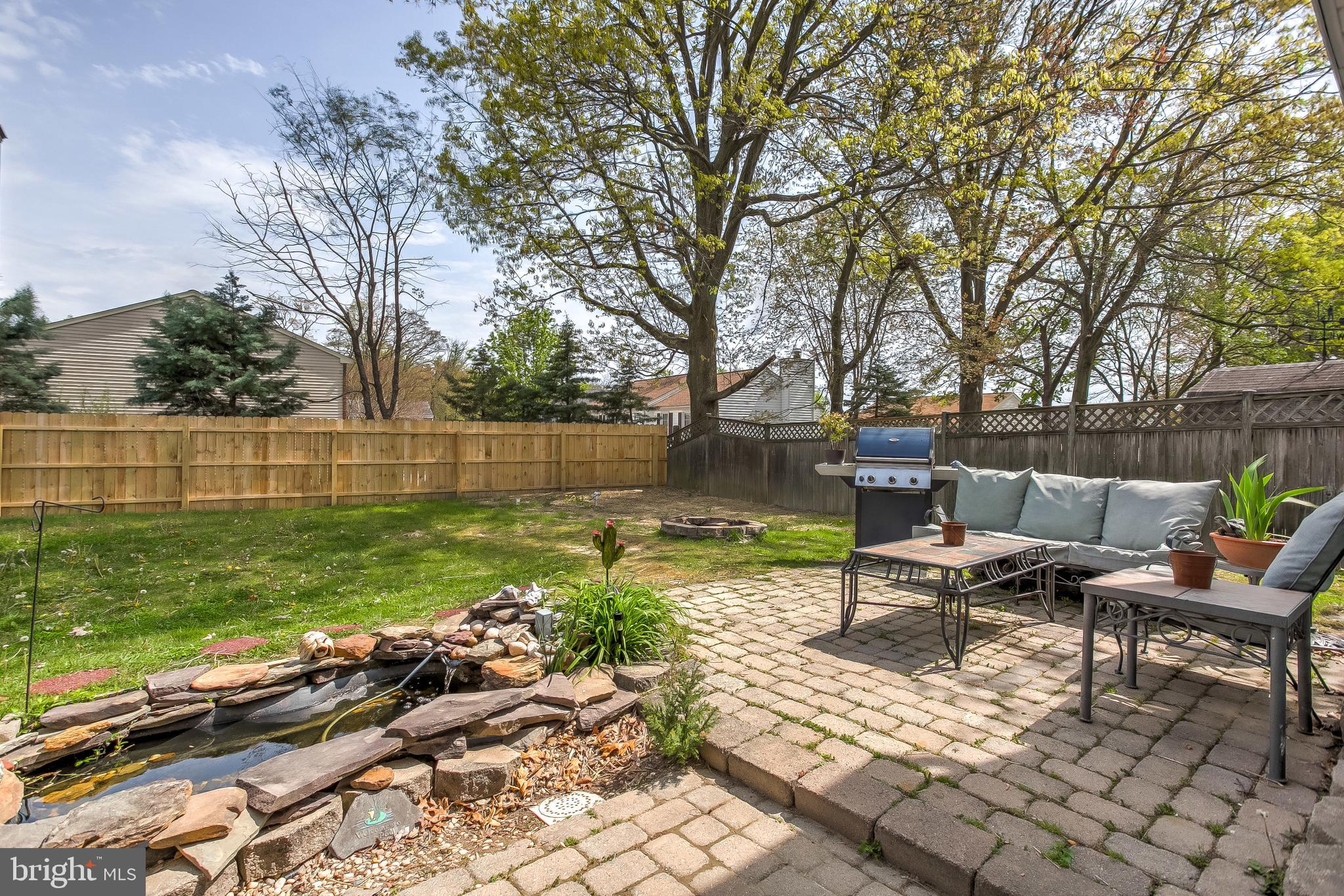 4223 Haycoke Road Baltimore, MD 21236 - Photo 32 of 43 Pond and patio, entertainment area.