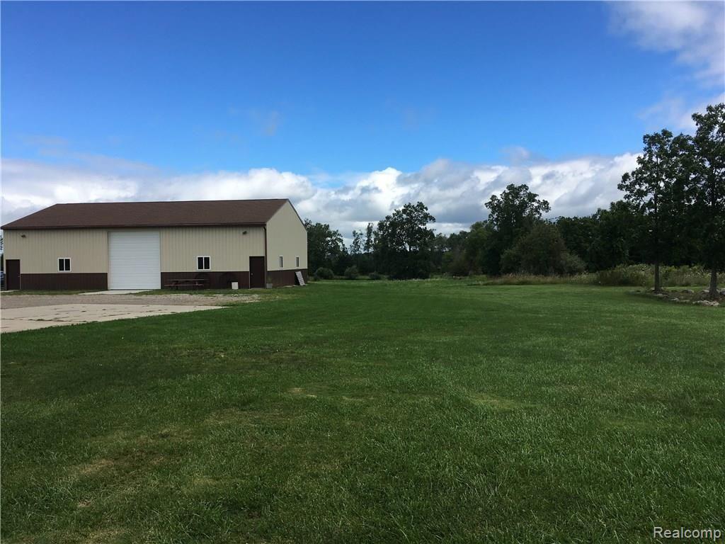 8778 Capac Road Brown City, MI 48416 - Photo 9 of 50 Pole barn 40 x 60 sq. ft. with new concrete floor.