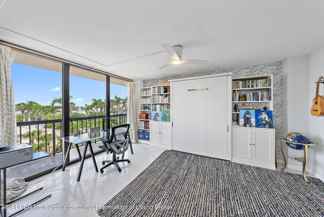 a view of a livingroom with furniture and staircase