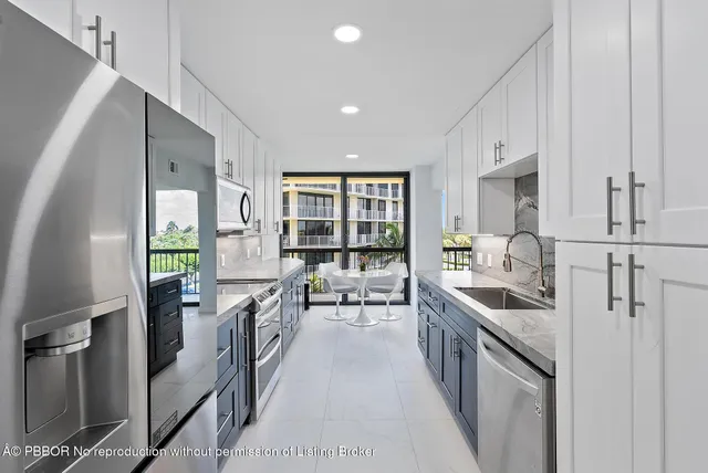 a kitchen with counter top space and stainless steel appliances
