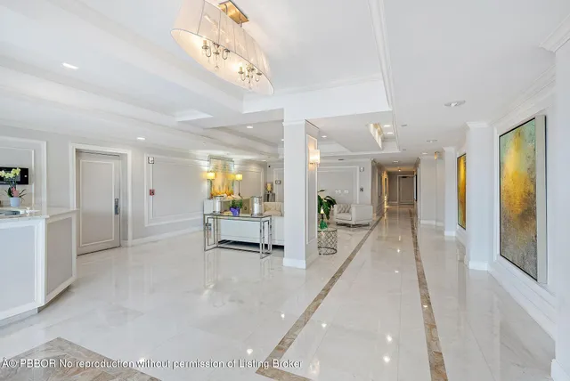 a view of empty room with wooden floor and floor to ceiling window