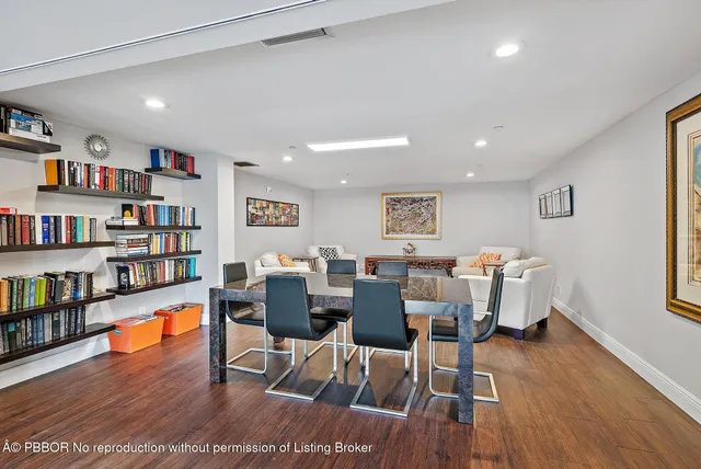 a view of a dining room with furniture wooden floor and chandelier