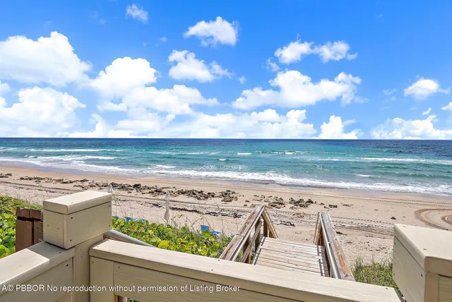 a view of swimming pool with outdoor seating and a potted plants