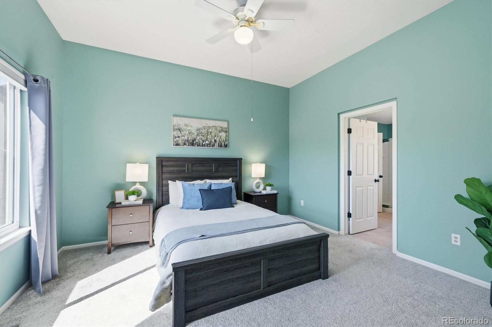 9629 Burberry Way Highlands Ranch, CO 80129 - Photo 25 of 50 a bedroom with a bed and a chandelier