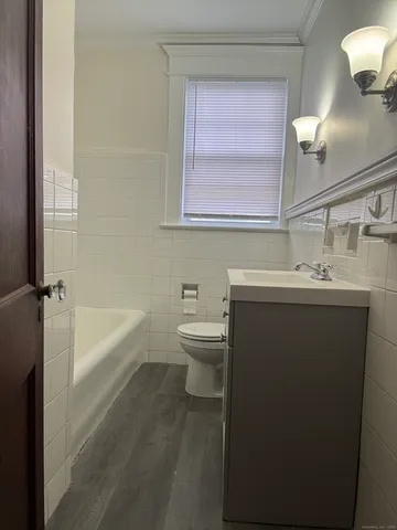 a bathroom with a sink a toilet and a bathtub