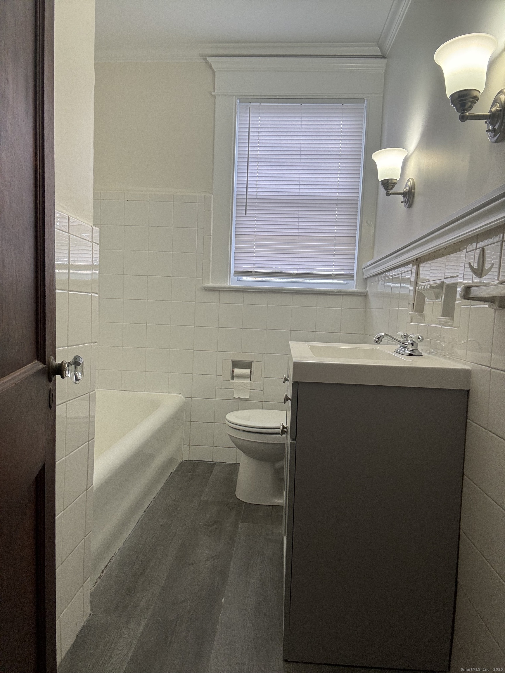 155 Elm Street, Unit 6 West Haven, CT 06516 - Photo 7 of 8 a bathroom with a sink a toilet and a bathtub