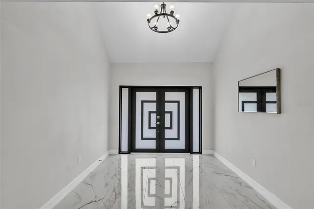 a view of an entryway with wooden floor