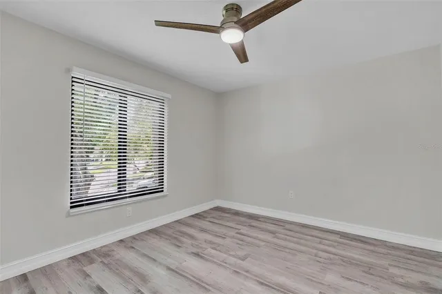 a bathroom with a shower sink and mirror
