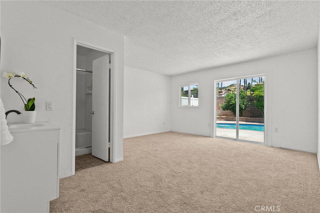 21124 Rosedell Drive Saugus, CA 91350 - Photo 11 of 14 an empty room with windows and closet