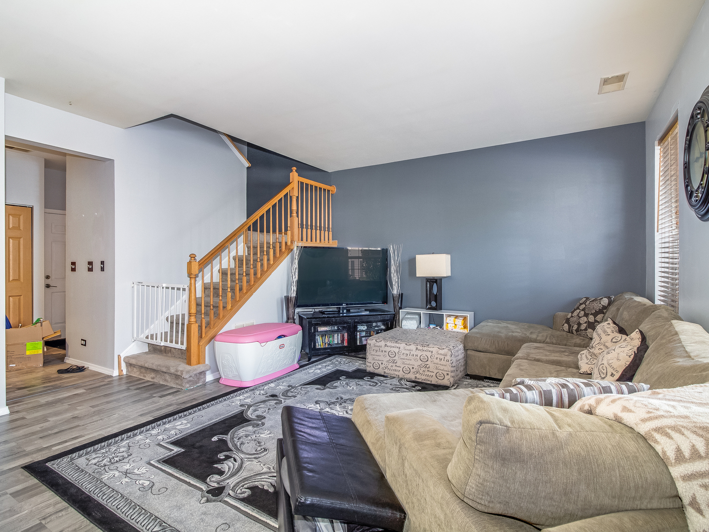 2262 Georgetown Circle Aurora, IL 60503 - Photo 2 of 25 a living room with furniture and a couch