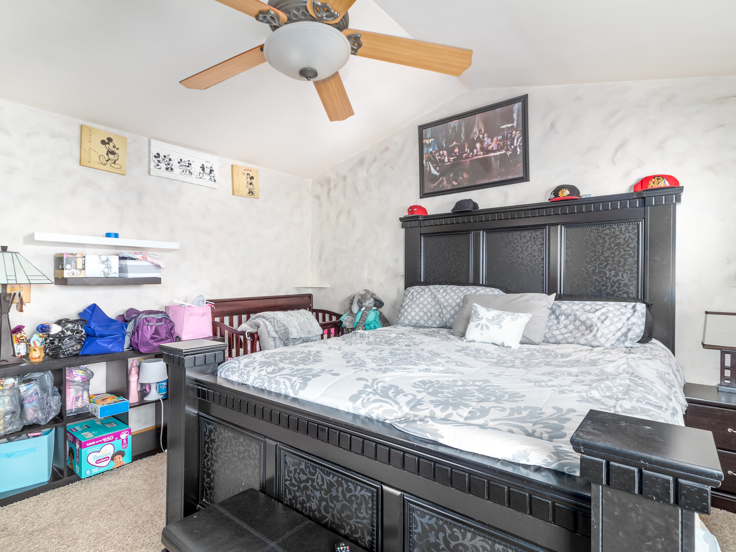 2262 Georgetown Circle Aurora, IL 60503 - Photo 13 of 25 a bedroom with a bed and a dresser in it