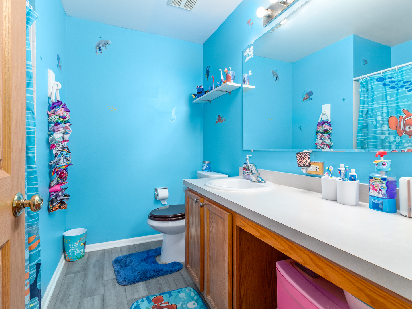 2262 Georgetown Circle Aurora, IL 60503 - Photo 21 of 25 a bathroom with a sink and a toilet