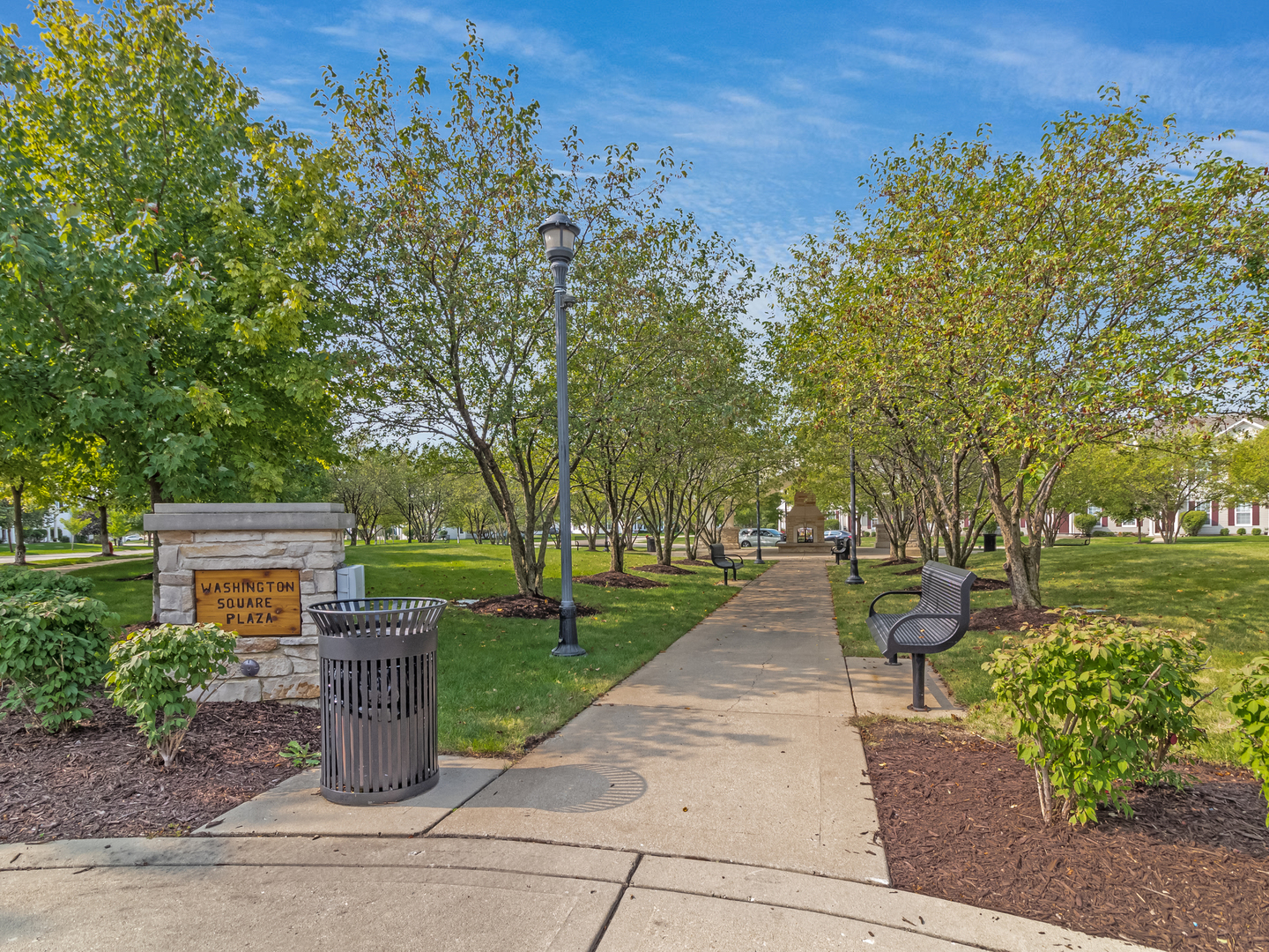 2262 Georgetown Circle Aurora, IL 60503 - Photo 24 of 25 a view of a pathway with a bench