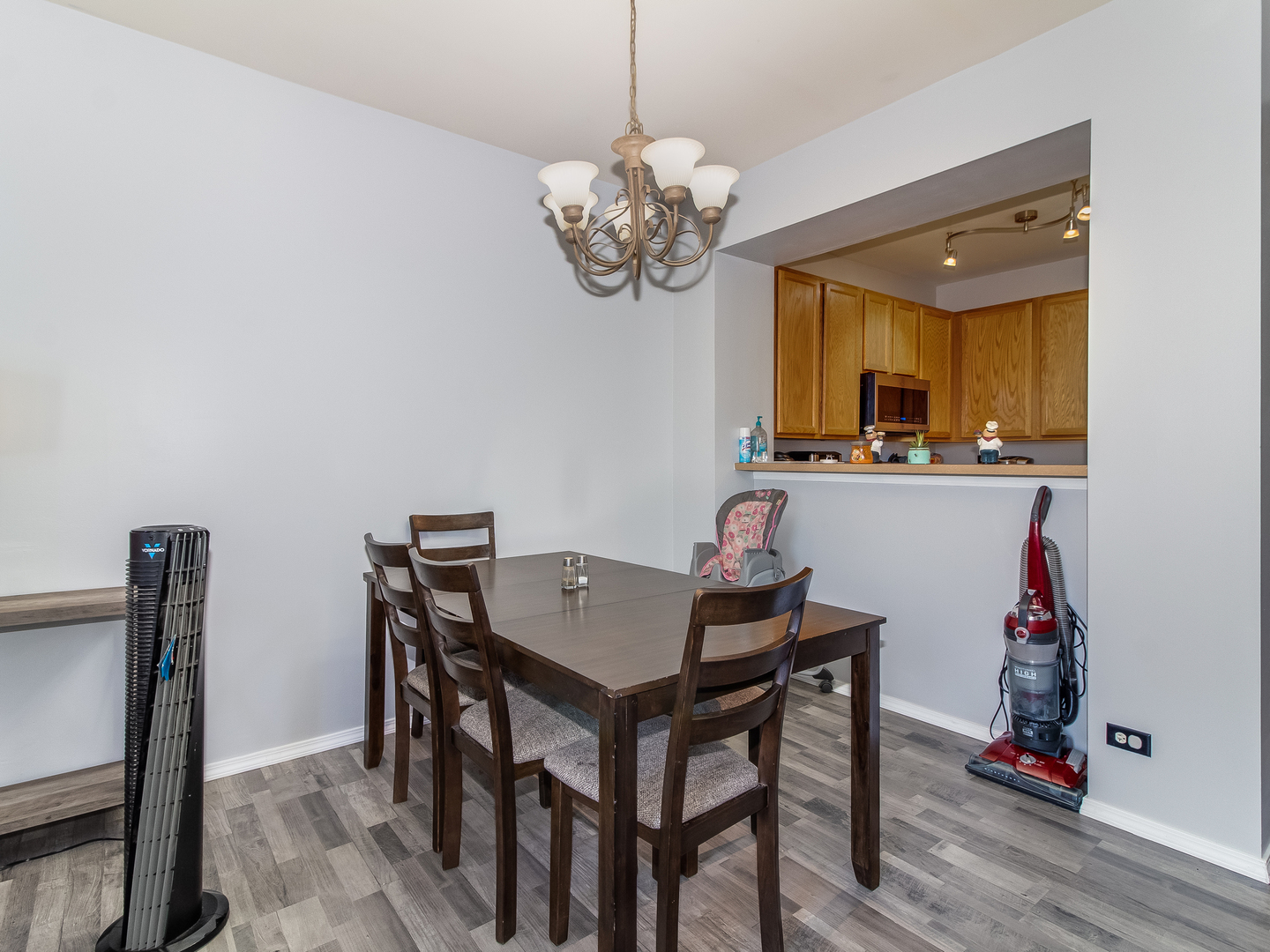2262 Georgetown Circle Aurora, IL 60503 - Photo 6 of 25 a view of a dining room with furniture and wooden floor