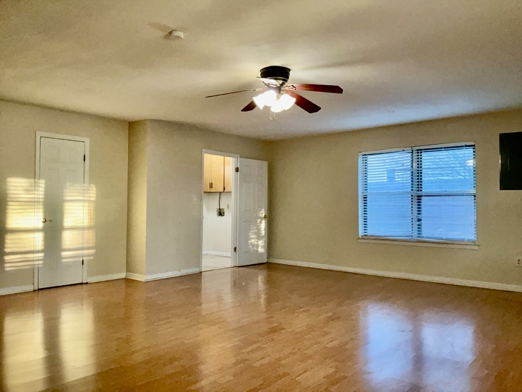 418 Sunset Drive Georgetown, TX 78628 - Photo 12 of 26 Second living room with light wood-type flooring, healthy amount of natural light, a ceiling fan, and a textured ceiling