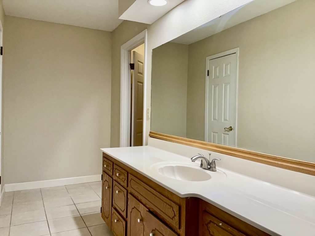 418 Sunset Drive Georgetown, TX 78628 - Photo 17 of 26 Bathroom with vanity and light tile patterned flooring