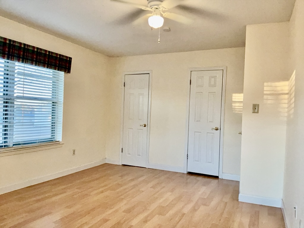 418 Sunset Drive Georgetown, TX 78628 - Photo 20 of 26 Bedroom featuring light wood-style flooring and a ceiling fan