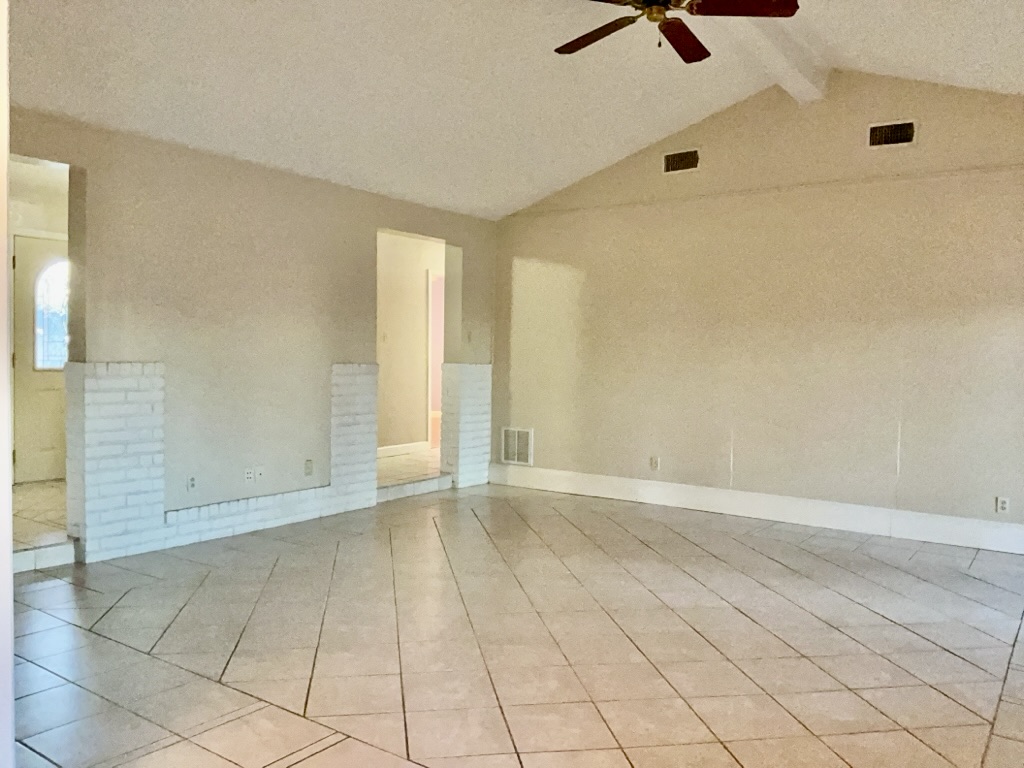 418 Sunset Drive Georgetown, TX 78628 - Photo 6 of 26 Living room with beamed ceiling, a ceiling fan, and light tile patterned floors