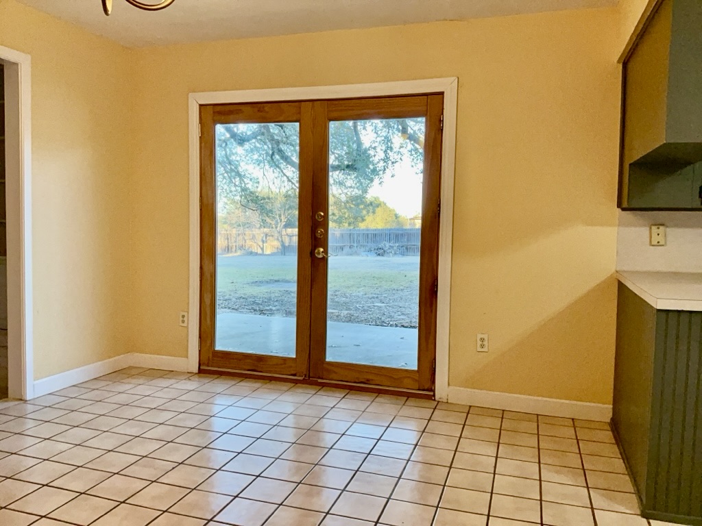 418 Sunset Drive Georgetown, TX 78628 - Photo 10 of 26 Dining room with suspended lighting, and ceiling fan, tile patterned flooring and french doors