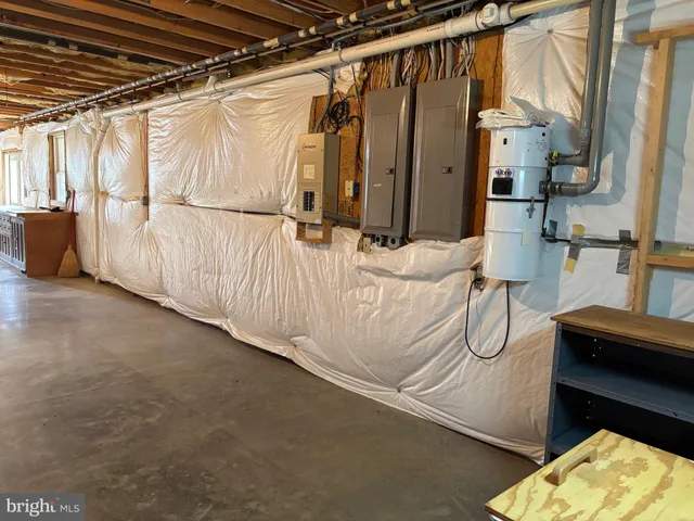 a view of a livingroom with wooden floor and a window