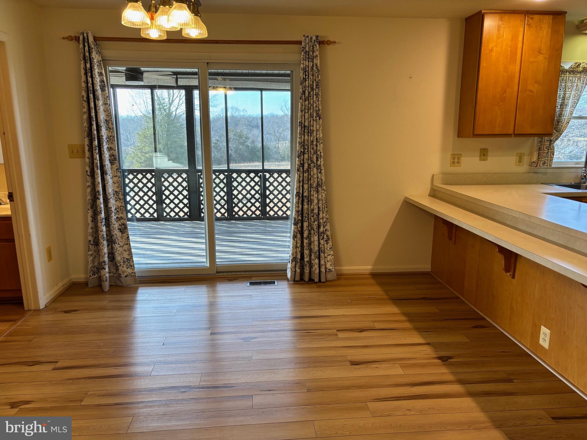 13238 Stonehouse Mountain Road Culpeper, VA 22701 - Photo 6 of 33 Dining & access to screened porch