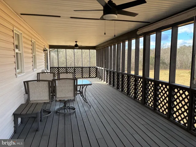 a view of a chairs and table on the wooden floor