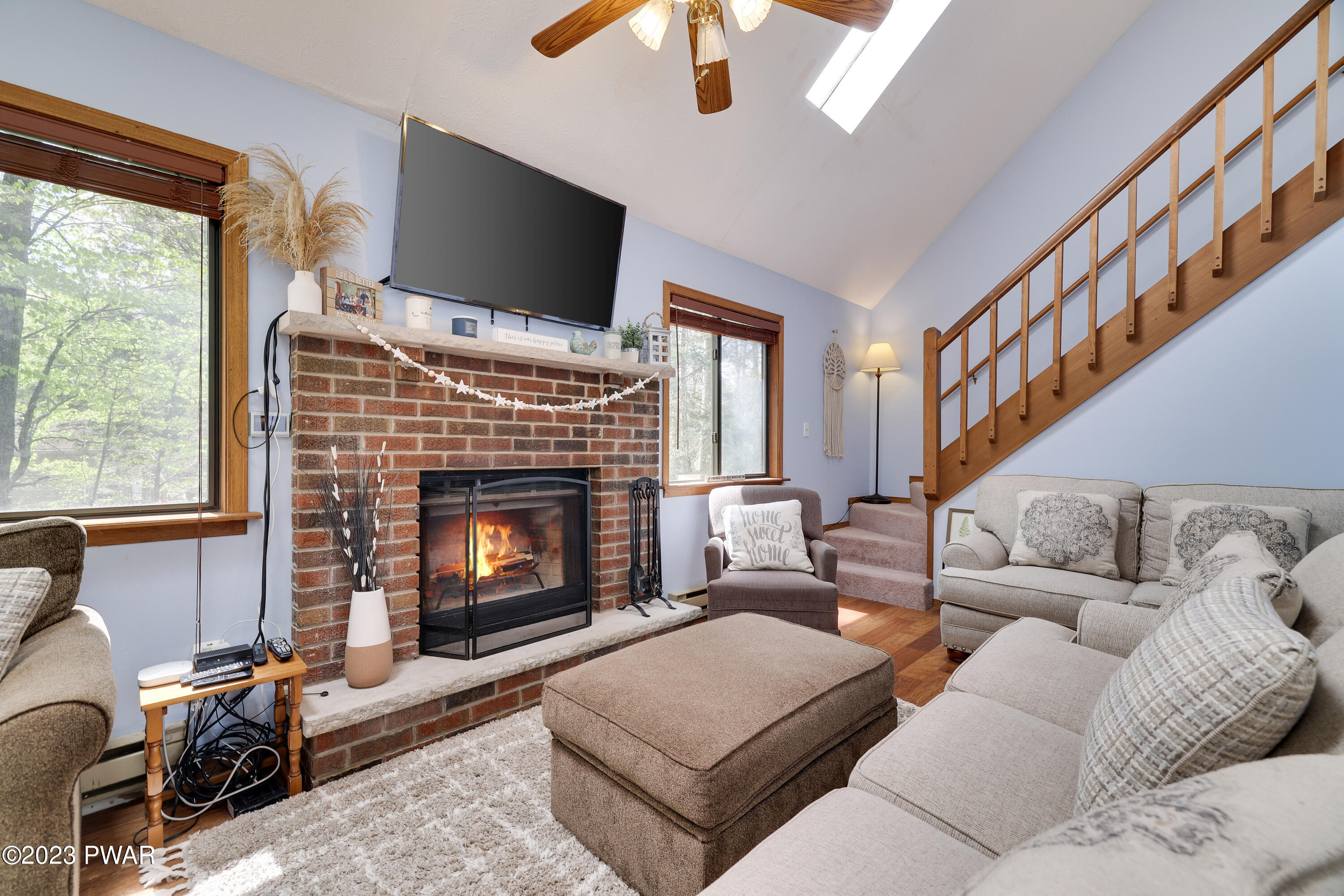 884 Goose Pond Road Lake Ariel, PA 18436 - Photo 9 of 39 a living room with furniture and a fireplace