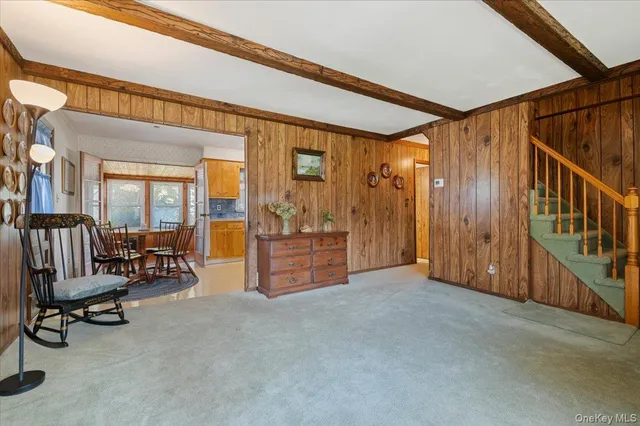 a view of a livingroom with furniture and a porch