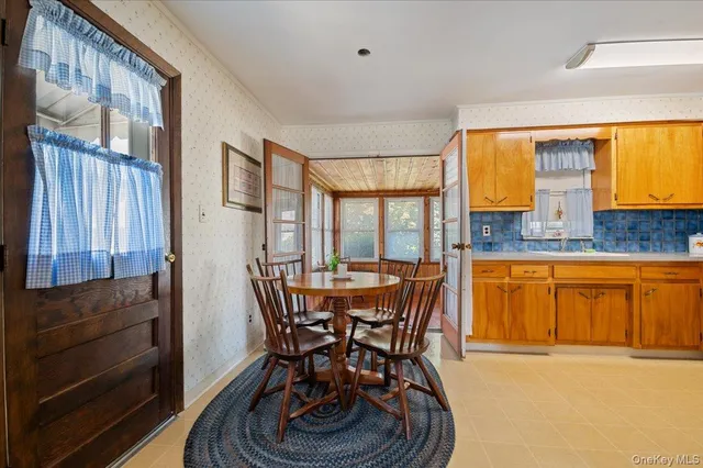 a dining room with furniture and window