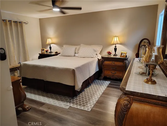 a bedroom with bed and a window