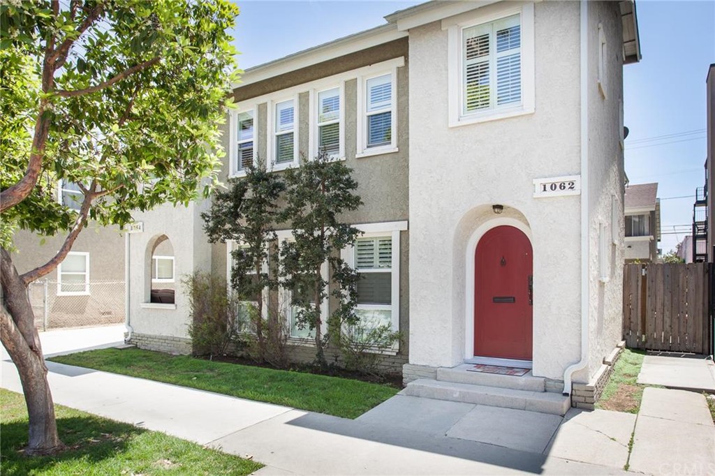 Front of building. Unit has the red door, and is the entire top level