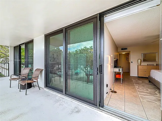 a view of a balcony with chairs