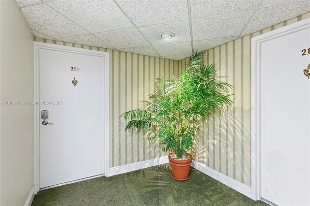 a view of a hallway with a white walls