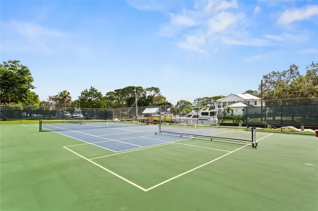 a view of swimming pool with a table and chairs