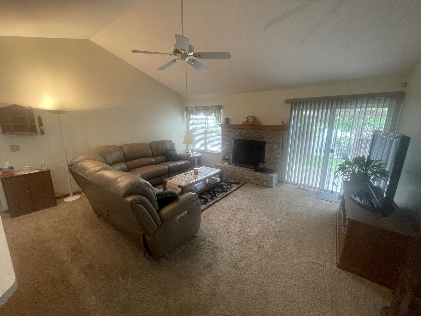 1827 Arbor Falls Drive Plainfield, IL 60586 - Photo 13 of 29 a living room with furniture and a fireplace