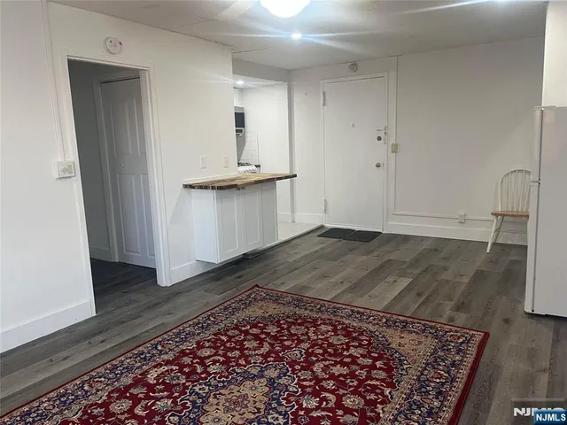 a kitchen with a sink stove and microwave