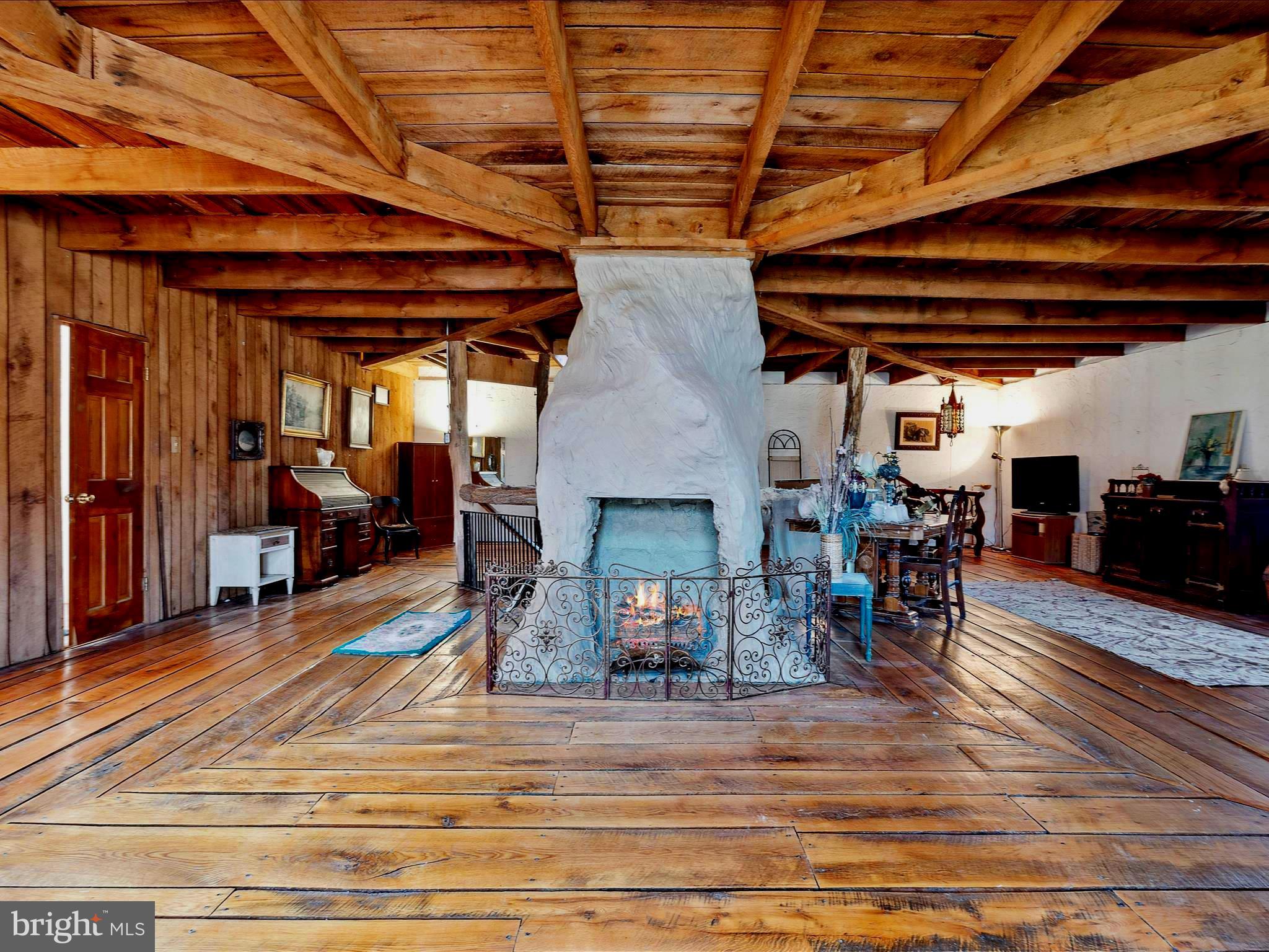 2822 Mauzy Road Berkeley Springs, WV 25411 - Photo 20 of 63 Upper level central propane fireplace