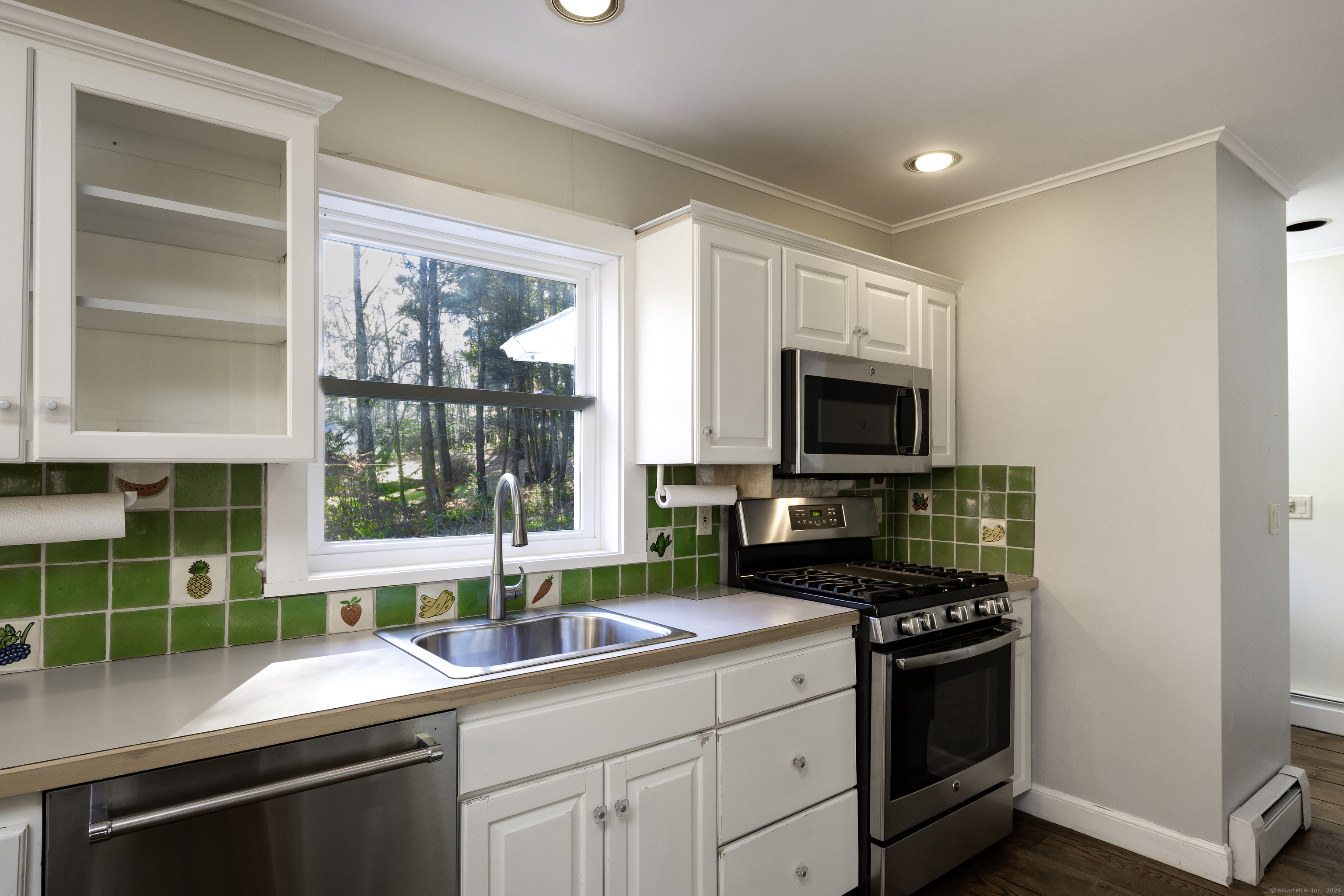 103 Geer Mountain Road South Kent, CT 06785 - Photo 15 of 36 a kitchen with a sink stove and microwave
