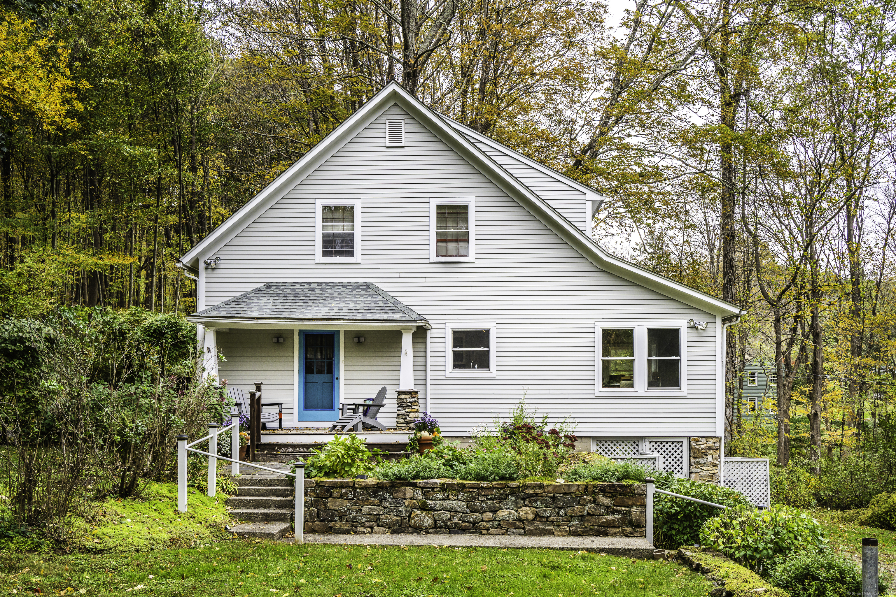 103 Geer Mountain Road South Kent, CT 06785 - Photo 2 of 36 a front view of house with yard and green space