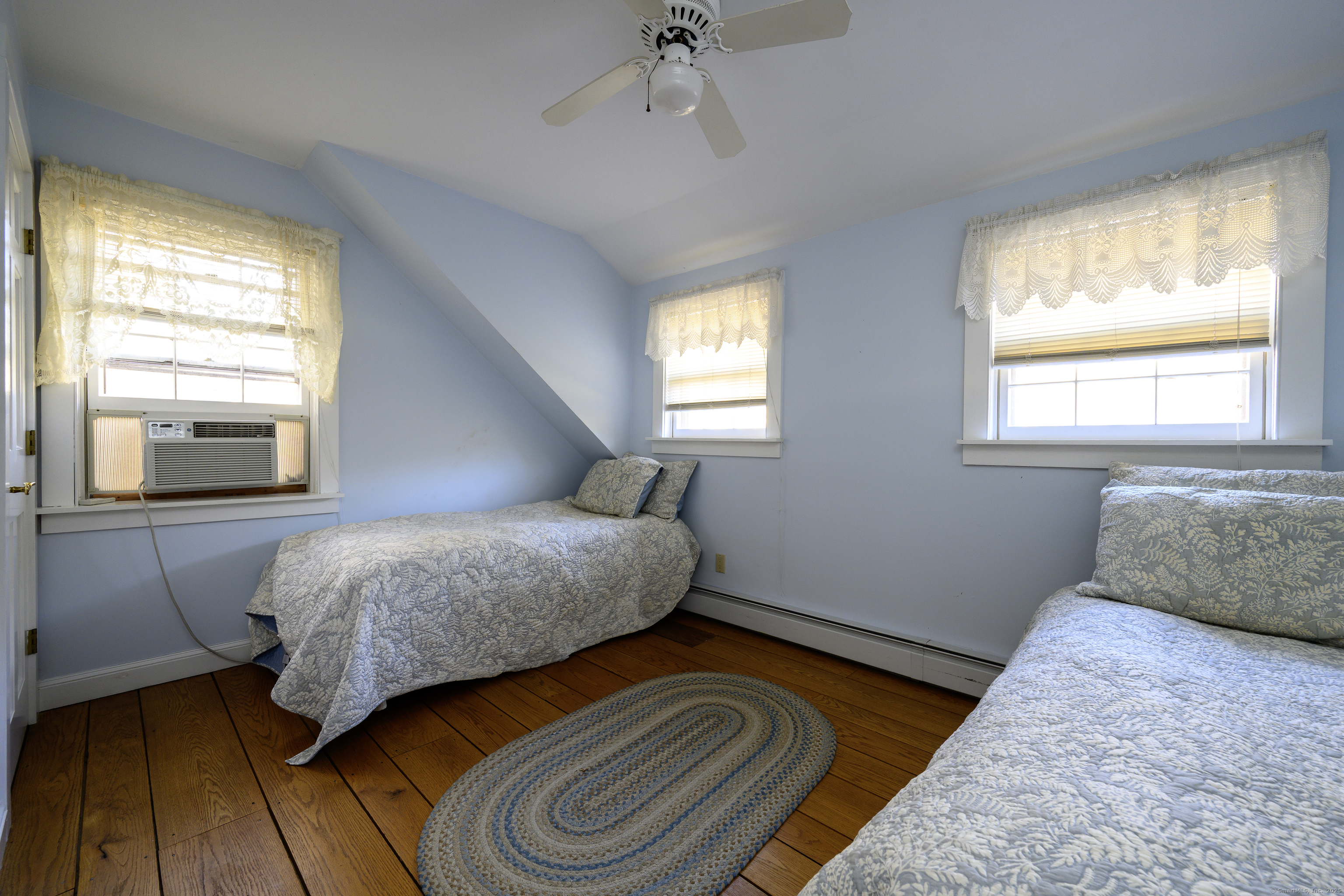 103 Geer Mountain Road South Kent, CT 06785 - Photo 23 of 36 a bedroom with a bed and a window