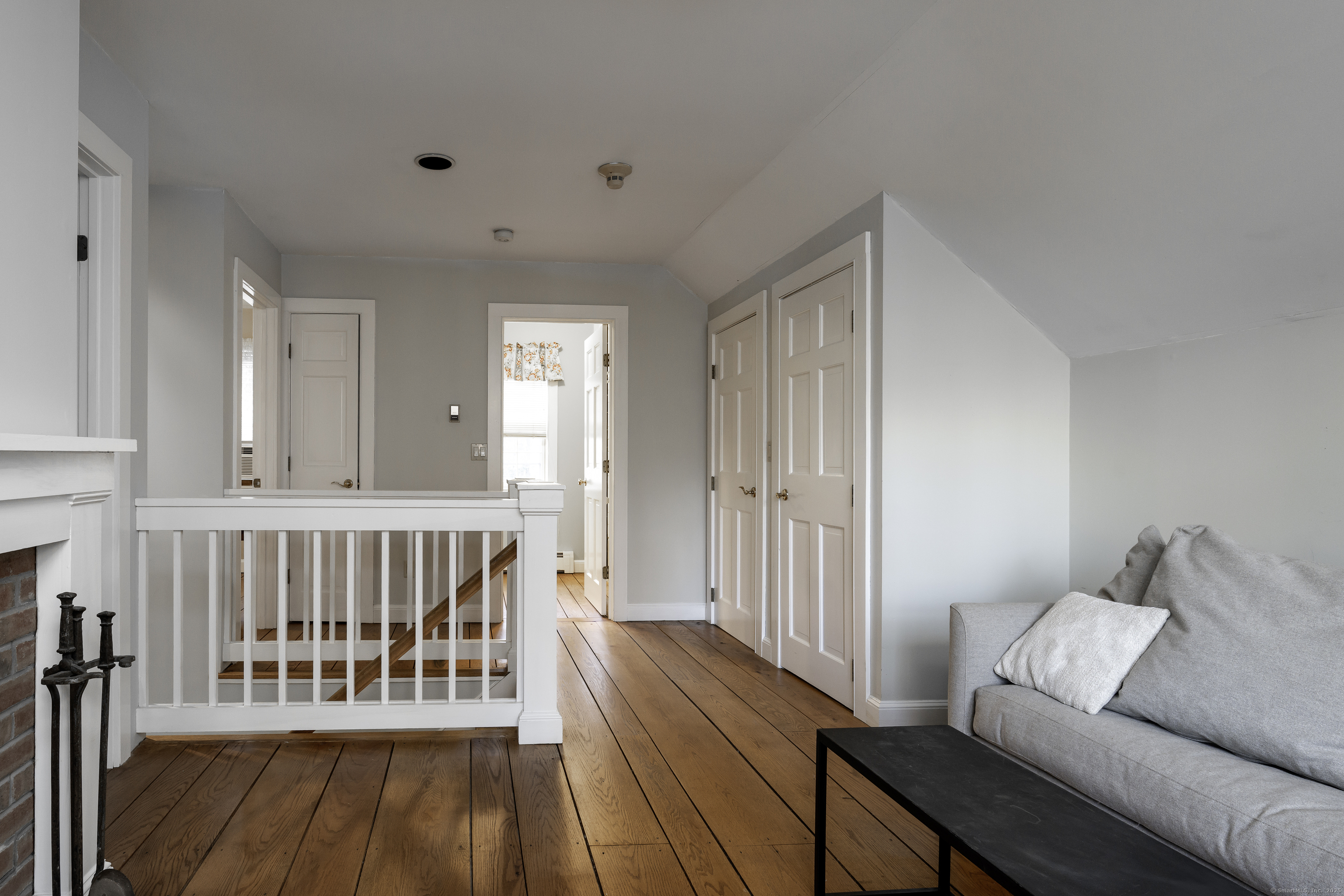 103 Geer Mountain Road South Kent, CT 06785 - Photo 25 of 36 a living room with furniture and a baby crib