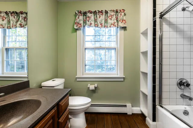 a bathroom with a sink a toilet and tub