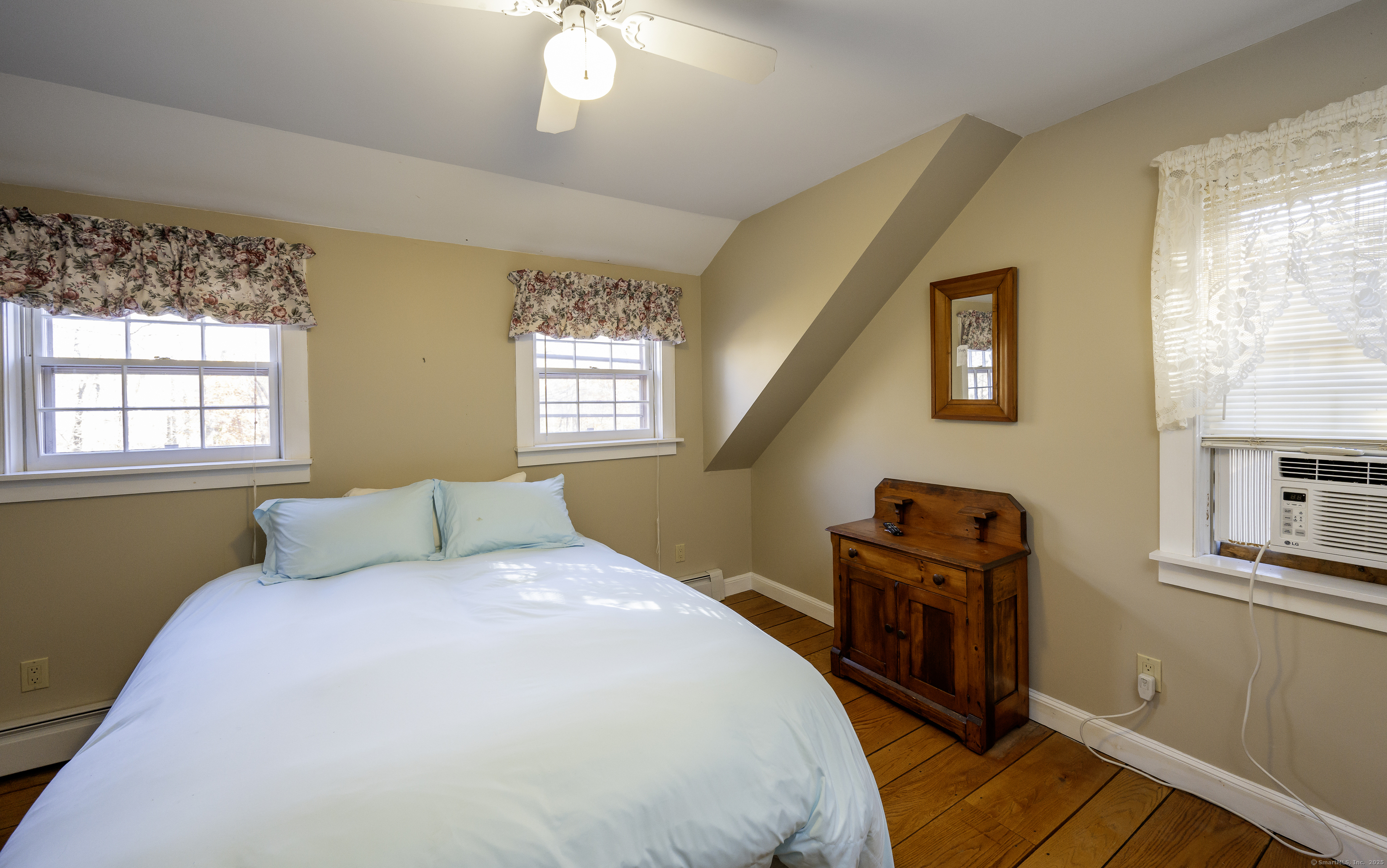 103 Geer Mountain Road South Kent, CT 06785 - Photo 27 of 36 a bedroom with a bed and a window