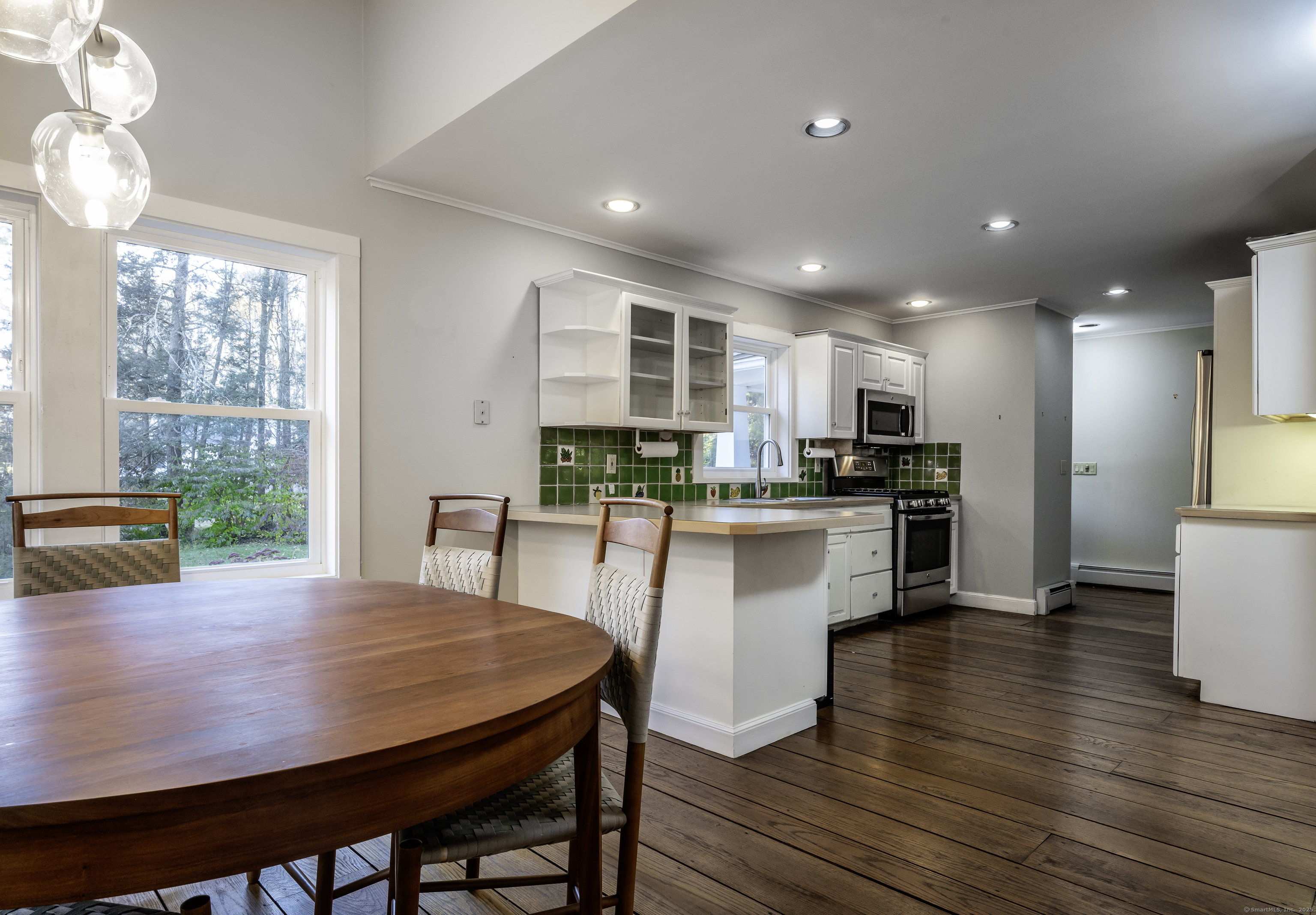 103 Geer Mountain Road South Kent, CT 06785 - Photo 29 of 36 a kitchen with a table and chairs in it