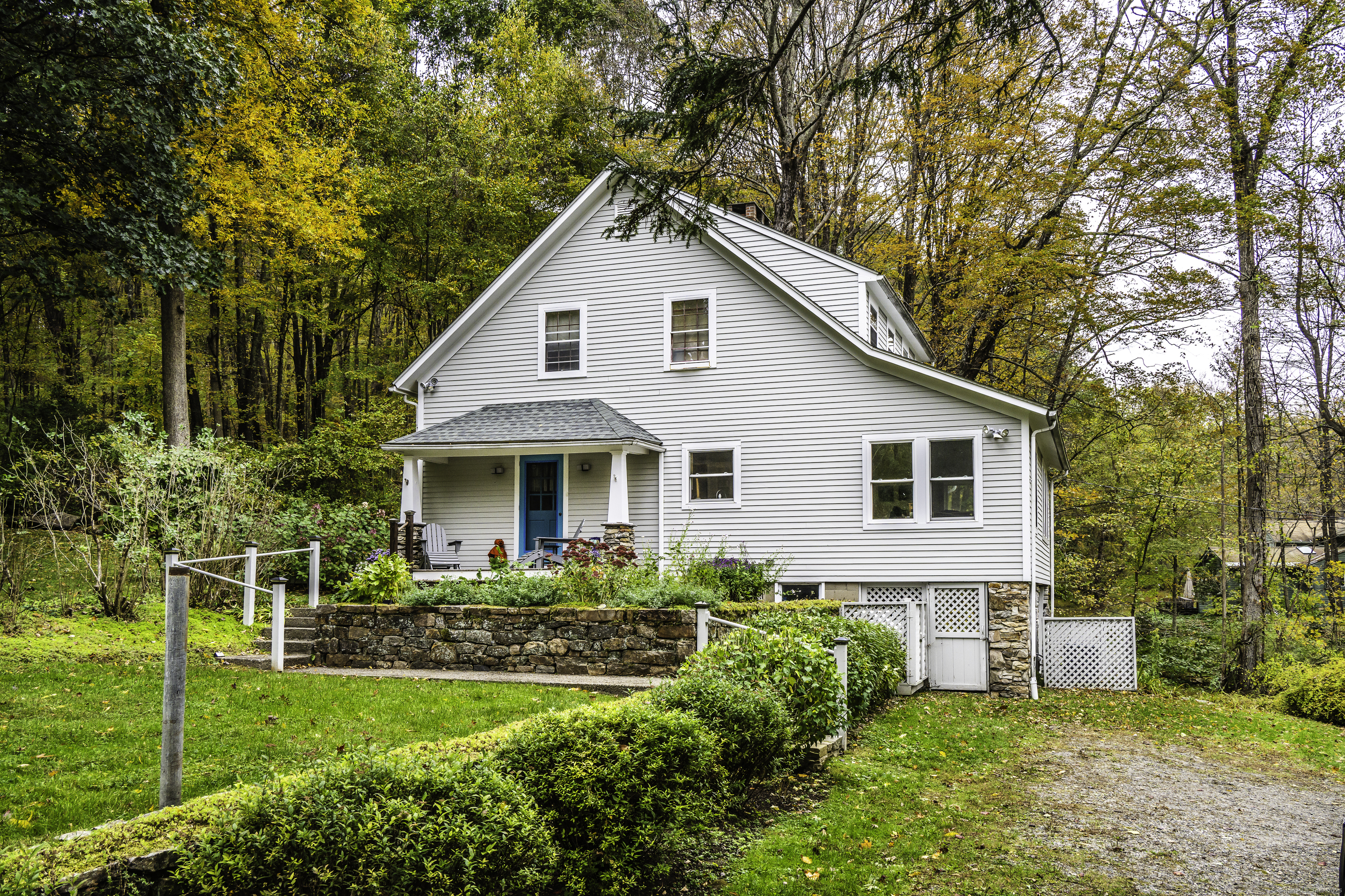 103 Geer Mountain Road South Kent, CT 06785 - Photo 3 of 36 a front view of house with yard and green space