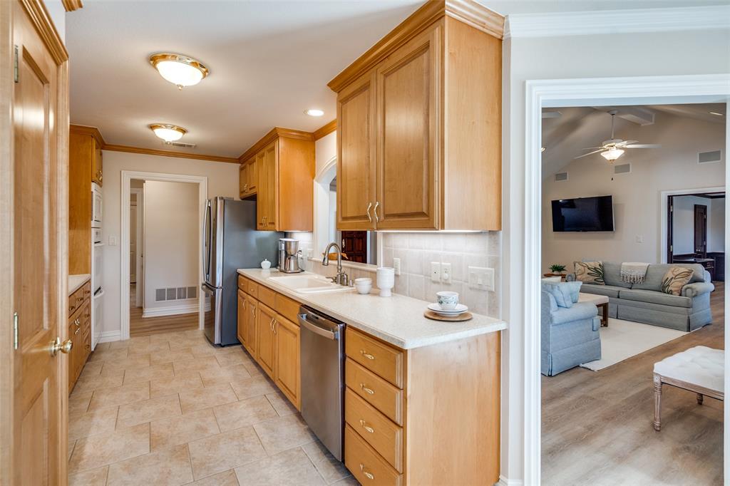 6604 Villa Road Dallas, TX 75252 - Photo 12 of 28 a kitchen with a sink stove and refrigerator