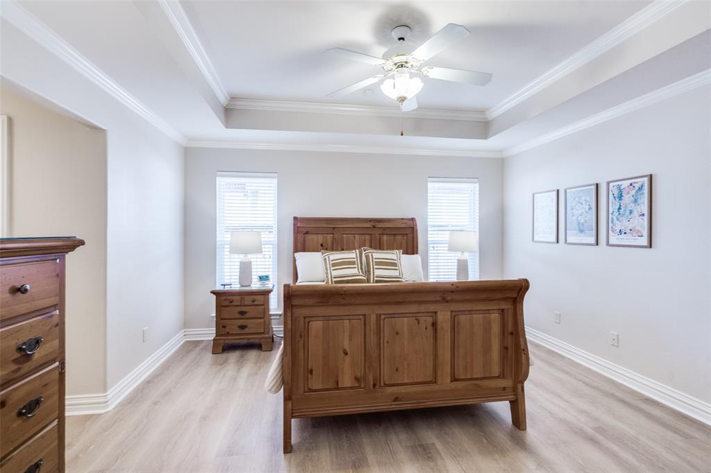 6604 Villa Road Dallas, TX 75252 - Photo 17 of 28 a bedroom with a bed and a dresser