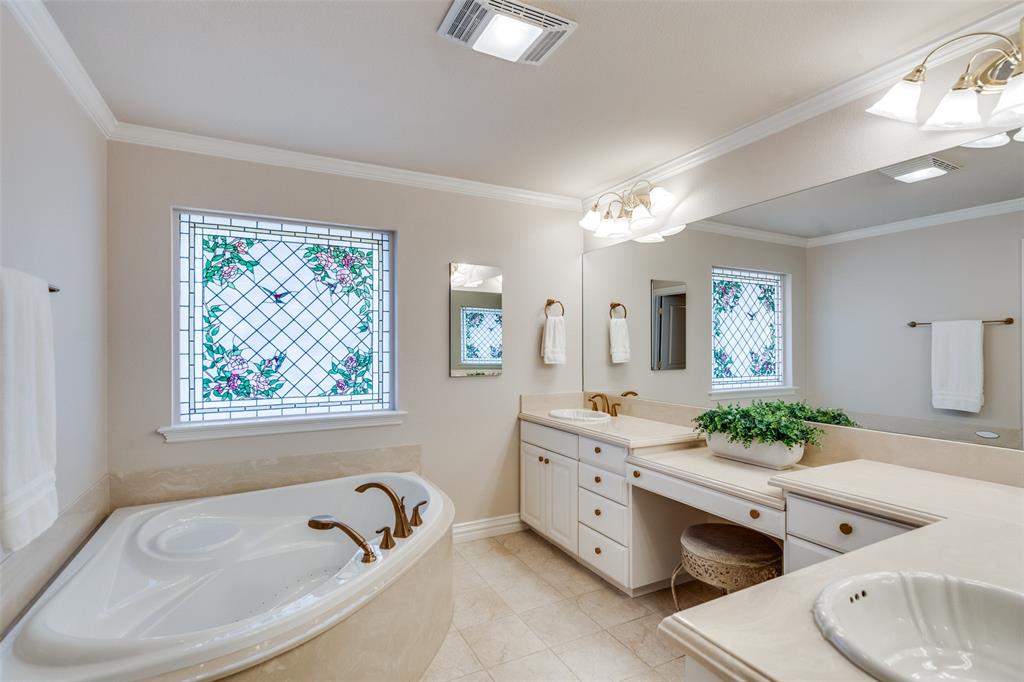 6604 Villa Road Dallas, TX 75252 - Photo 18 of 28 a spacious bathroom with a granite countertop tub and a sink