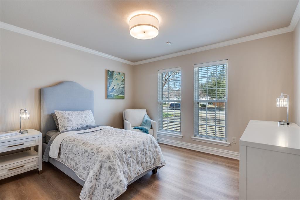 6604 Villa Road Dallas, TX 75252 - Photo 21 of 28 a bedroom with a bed and a window